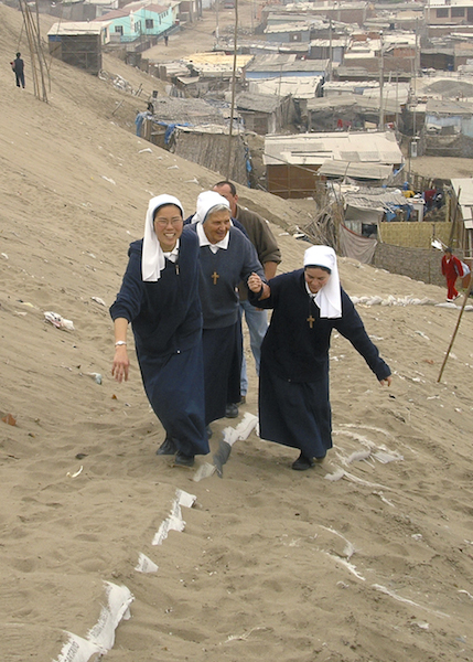 Figure 1: Petrozzi with two
co-Sisters in Villa El Salvador, located on the outskirts of Lima, Peru